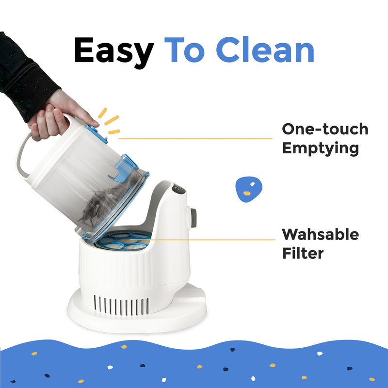 Grooming vacuum in use on dog